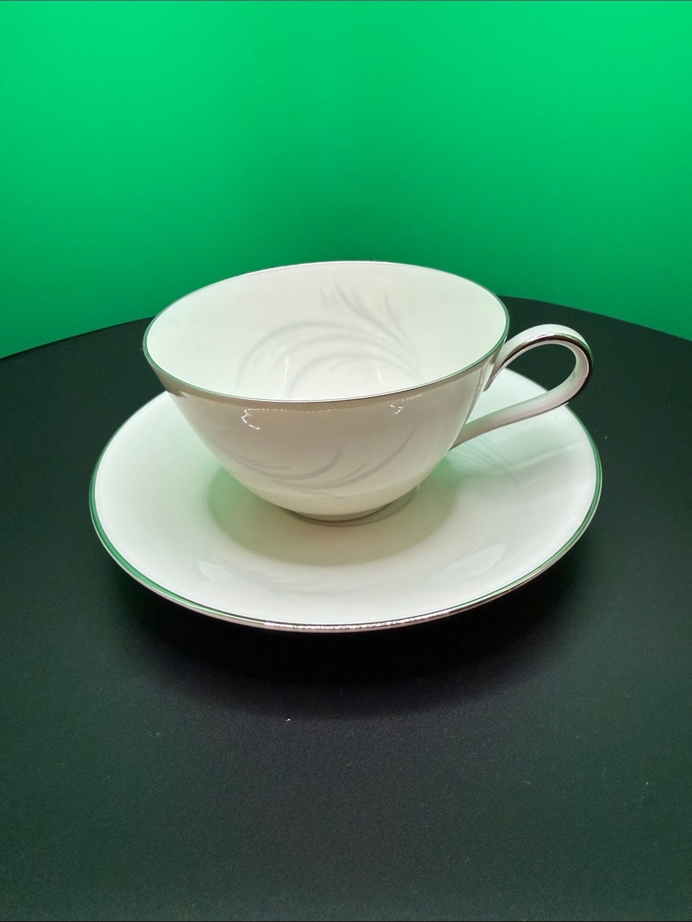 White Porcelain Teacup and Saucer with Silver Trim - Vintage